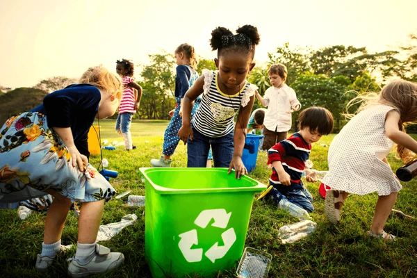 kids-learning-how-recycle-trash-600nw-1099645115